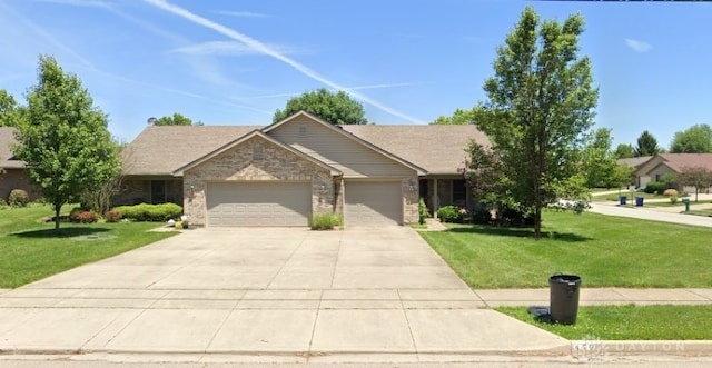 ranch-style house with a garage and a front lawn