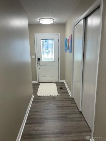 doorway featuring dark hardwood / wood-style flooring