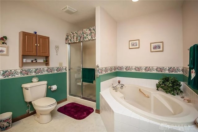 bathroom featuring tile patterned floors, separate shower and tub, and toilet