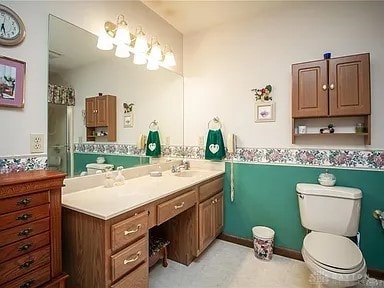 bathroom with vanity and toilet