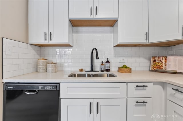 kitchen with tasteful backsplash, white cabinets, and dishwasher