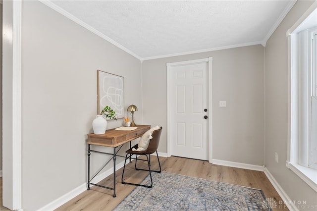 foyer entrance with light hardwood / wood-style flooring and ornamental molding