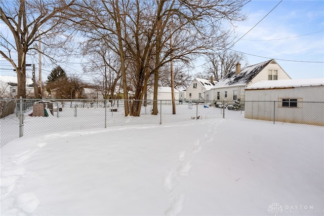 view of yard layered in snow