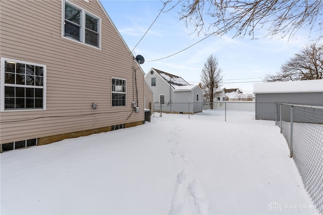 view of yard layered in snow