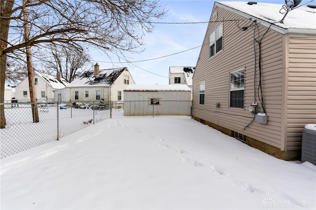 view of yard layered in snow