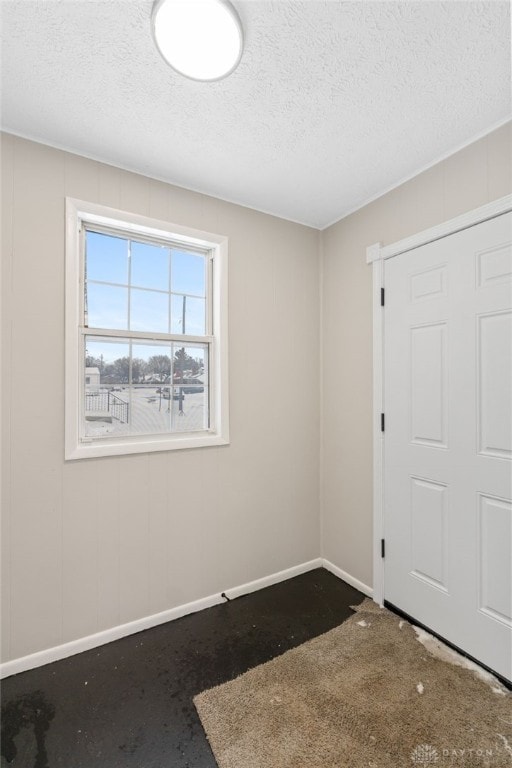 empty room featuring a textured ceiling