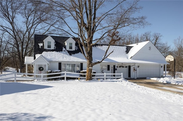 new england style home with a garage