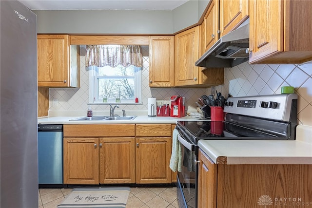 kitchen featuring light tile patterned flooring, backsplash, stainless steel appliances, and sink