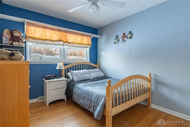 bedroom featuring ceiling fan and light hardwood / wood-style flooring