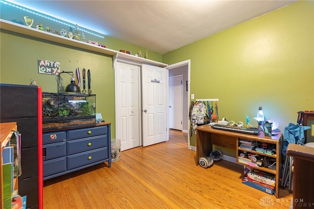 office space with light wood-type flooring