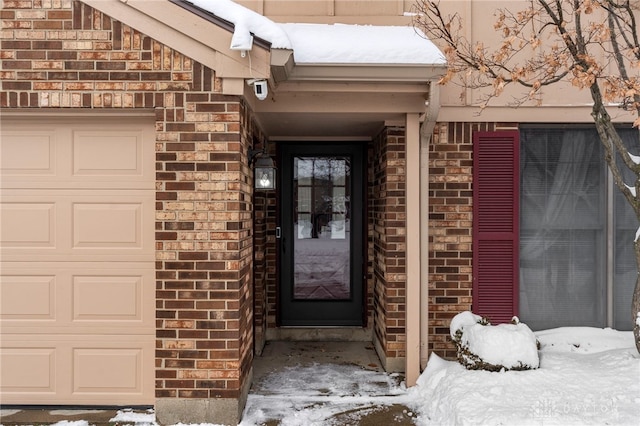 view of snow covered property entrance