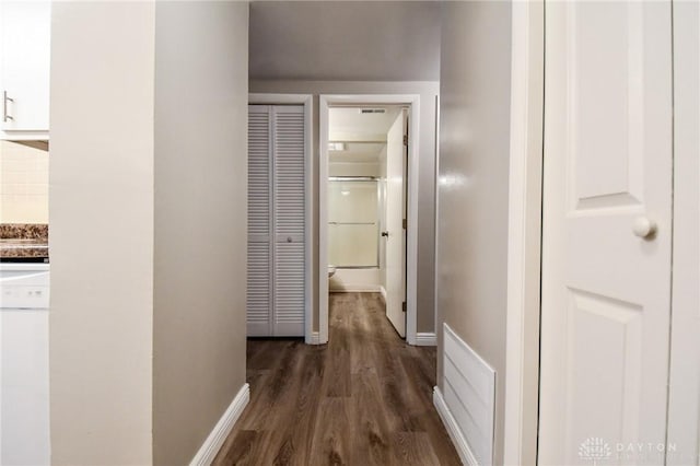 hall with dark hardwood / wood-style floors