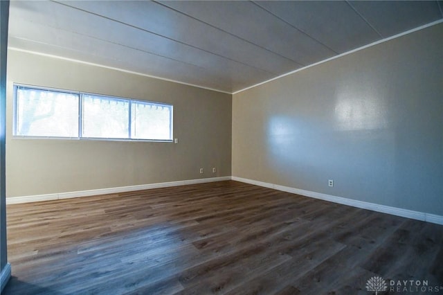 empty room featuring dark wood-type flooring