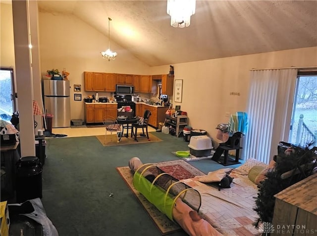 interior space with a chandelier, light carpet, and vaulted ceiling