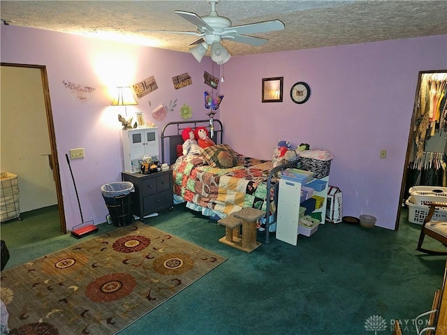 bedroom with ceiling fan, a textured ceiling, and dark colored carpet