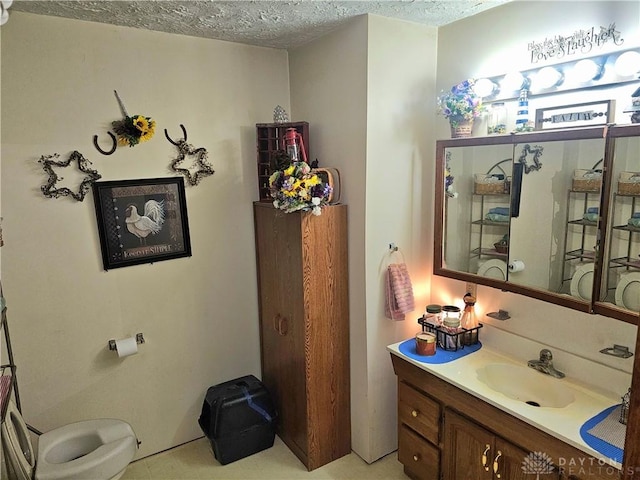 bathroom featuring vanity and a textured ceiling