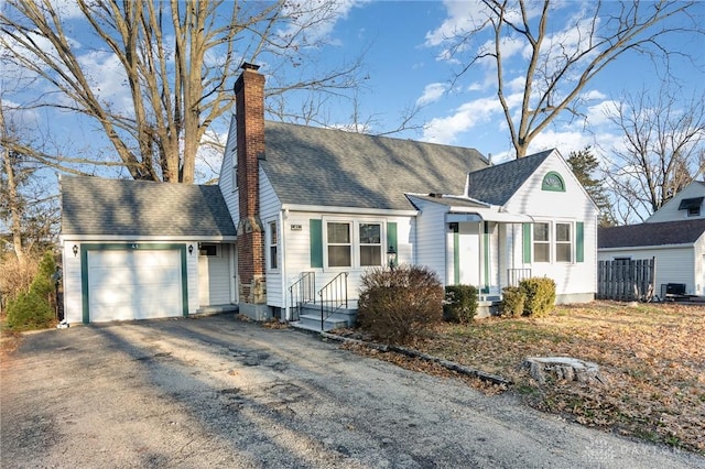 view of front of home with a garage and central air condition unit