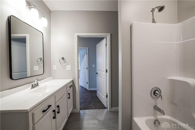 bathroom featuring vanity and shower / bathtub combination