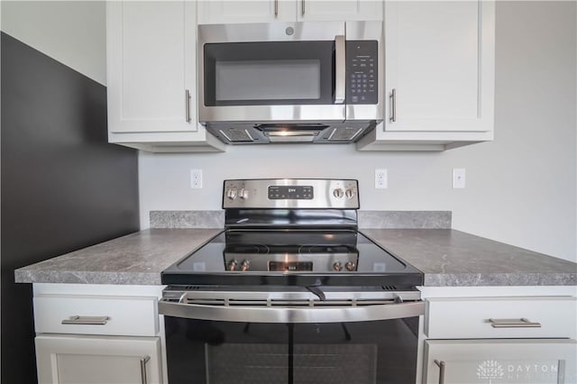 kitchen featuring white cabinetry and stainless steel appliances