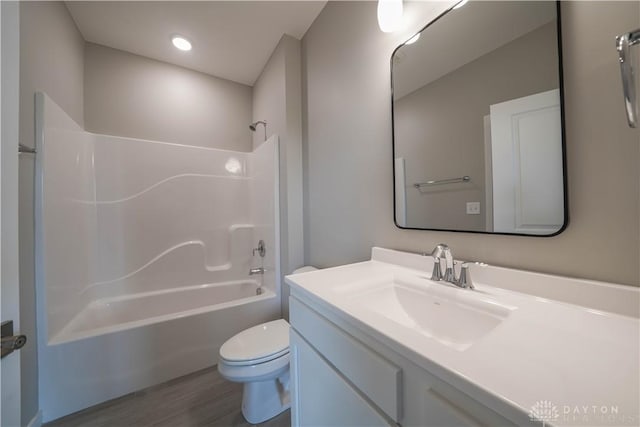 full bathroom with shower / bathing tub combination, vanity, toilet, and wood-type flooring