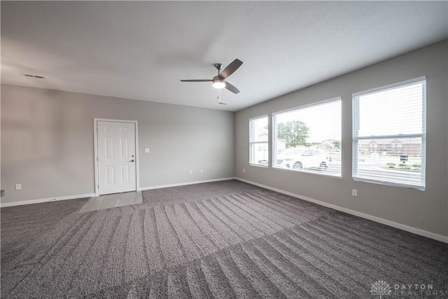 carpeted empty room with ceiling fan