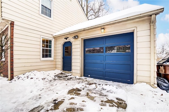 view of snow covered garage