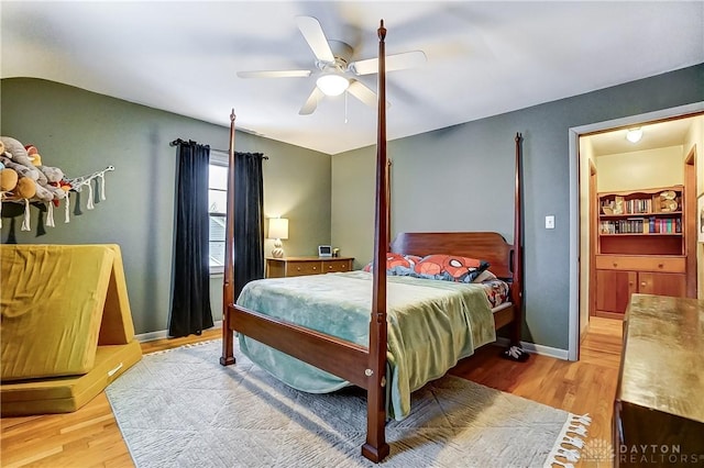 bedroom with ceiling fan and light wood-type flooring