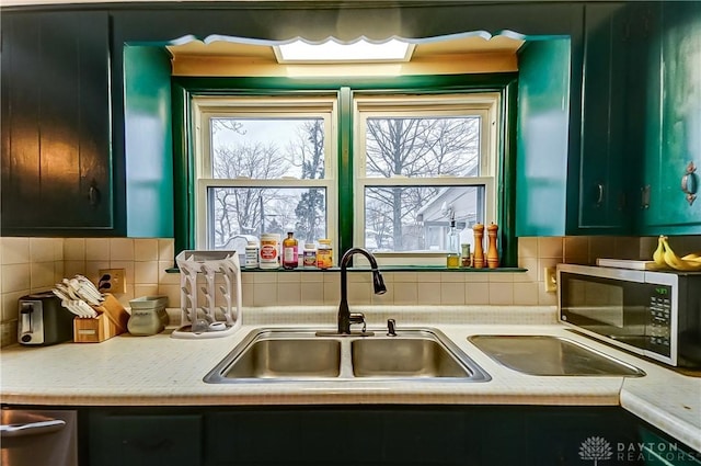 kitchen with backsplash and sink