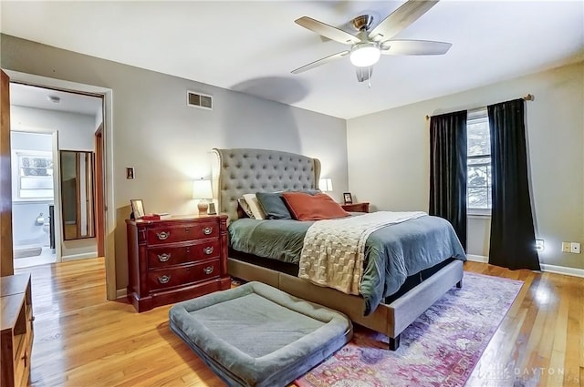 bedroom with ceiling fan and light hardwood / wood-style flooring