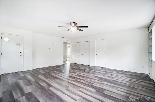 interior space featuring ceiling fan and dark wood-type flooring