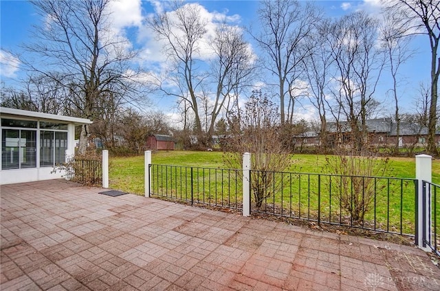 view of patio / terrace featuring a sunroom