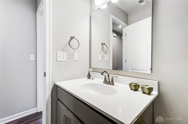 bathroom with wood-type flooring and vanity