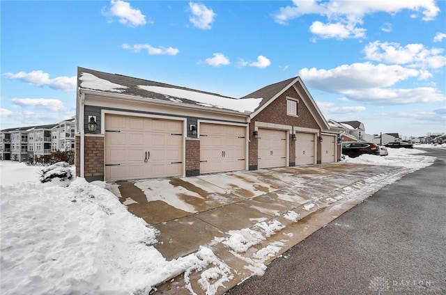 view of snow covered garage