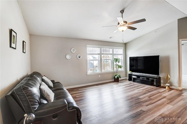 living room with ceiling fan and wood-type flooring