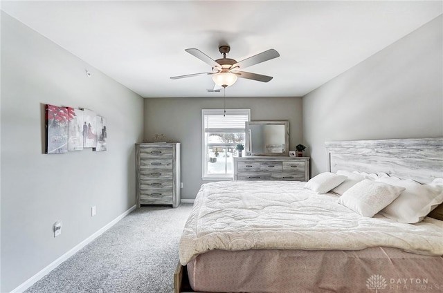 bedroom featuring light carpet and ceiling fan