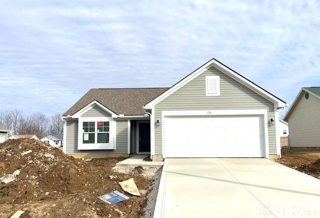 ranch-style home featuring an attached garage, driveway, and roof with shingles