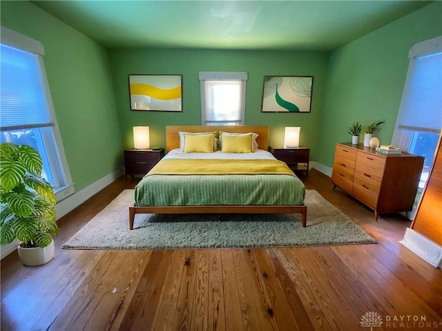 bedroom with hardwood / wood-style floors