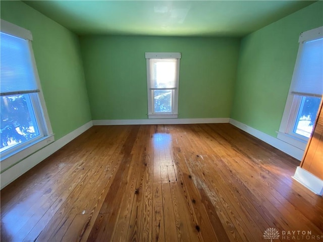 spare room with hardwood / wood-style flooring