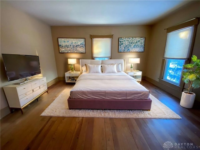 bedroom with hardwood / wood-style flooring