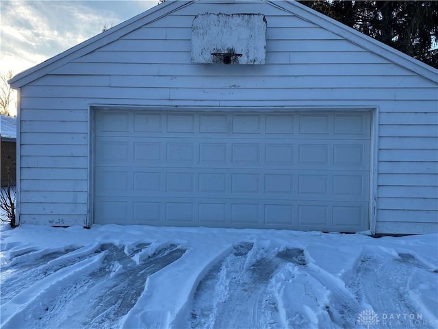 view of snow covered garage