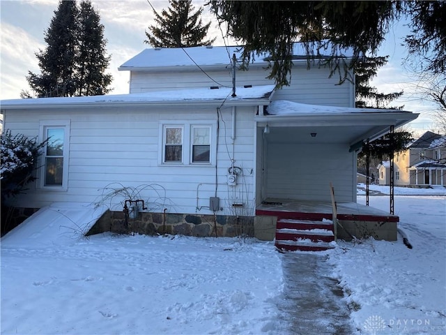 view of snow covered property