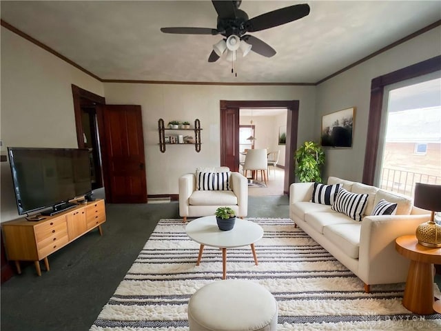 carpeted living room featuring a baseboard heating unit, ceiling fan, and ornamental molding