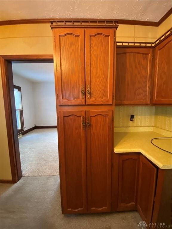 kitchen featuring light colored carpet