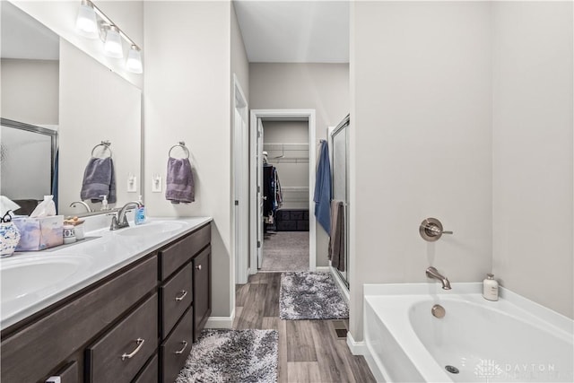 1189 Heathgate Way, Fairborn, OH 45324 - full bathroom featuring double vanity, wood finished floors, a stall shower, and a sink