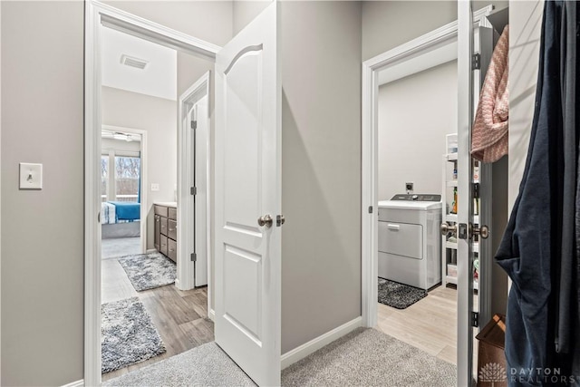 1189 Heathgate Way, Fairborn, OH 45324 - interior space with washer / dryer, visible vents, light wood-style flooring, and baseboards