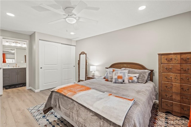 1189 Heathgate Way, Fairborn, OH 45324 - bedroom featuring a sink, a closet, light wood-type flooring, ceiling fan, and recessed lighting