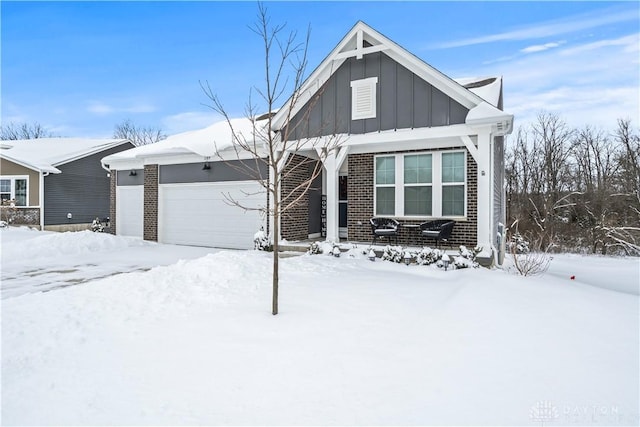 1189 Heathgate Way, Fairborn, OH 45324 - view of front of property with board and batten siding, brick siding, and a garage