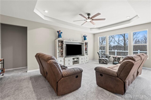 1189 Heathgate Way, Fairborn, OH 45324 - living area with carpet, a ceiling fan, baseboards, and a raised ceiling