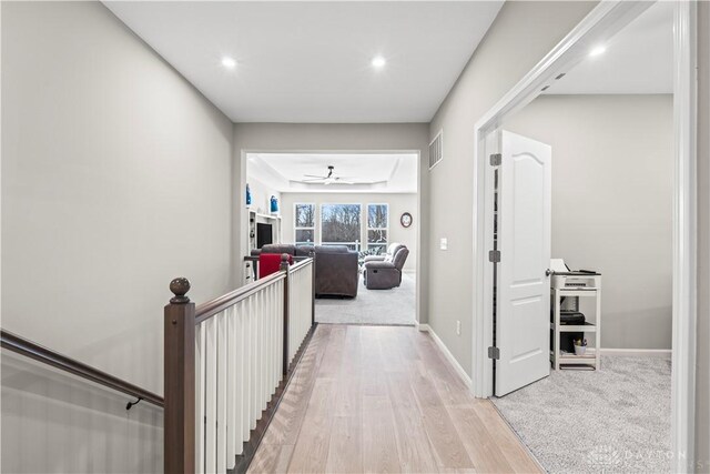 1189 Heathgate Way, Fairborn, OH 45324 - corridor featuring an upstairs landing, recessed lighting, visible vents, light wood-style flooring, and baseboards