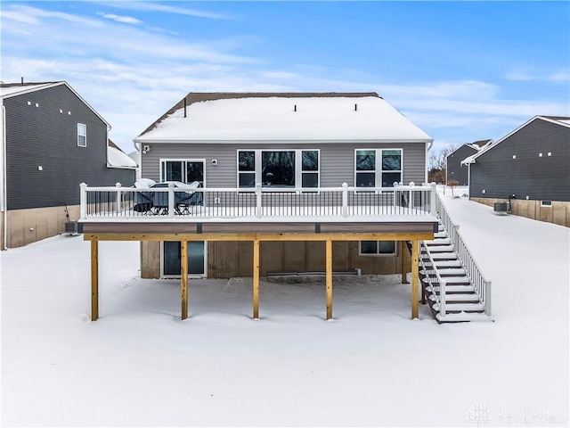 1189 Heathgate Way, Fairborn, OH 45324 - snow covered rear of property featuring stairway and a wooden deck